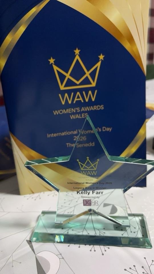The Legacy Award trophy displayed with the finalists brochure spread